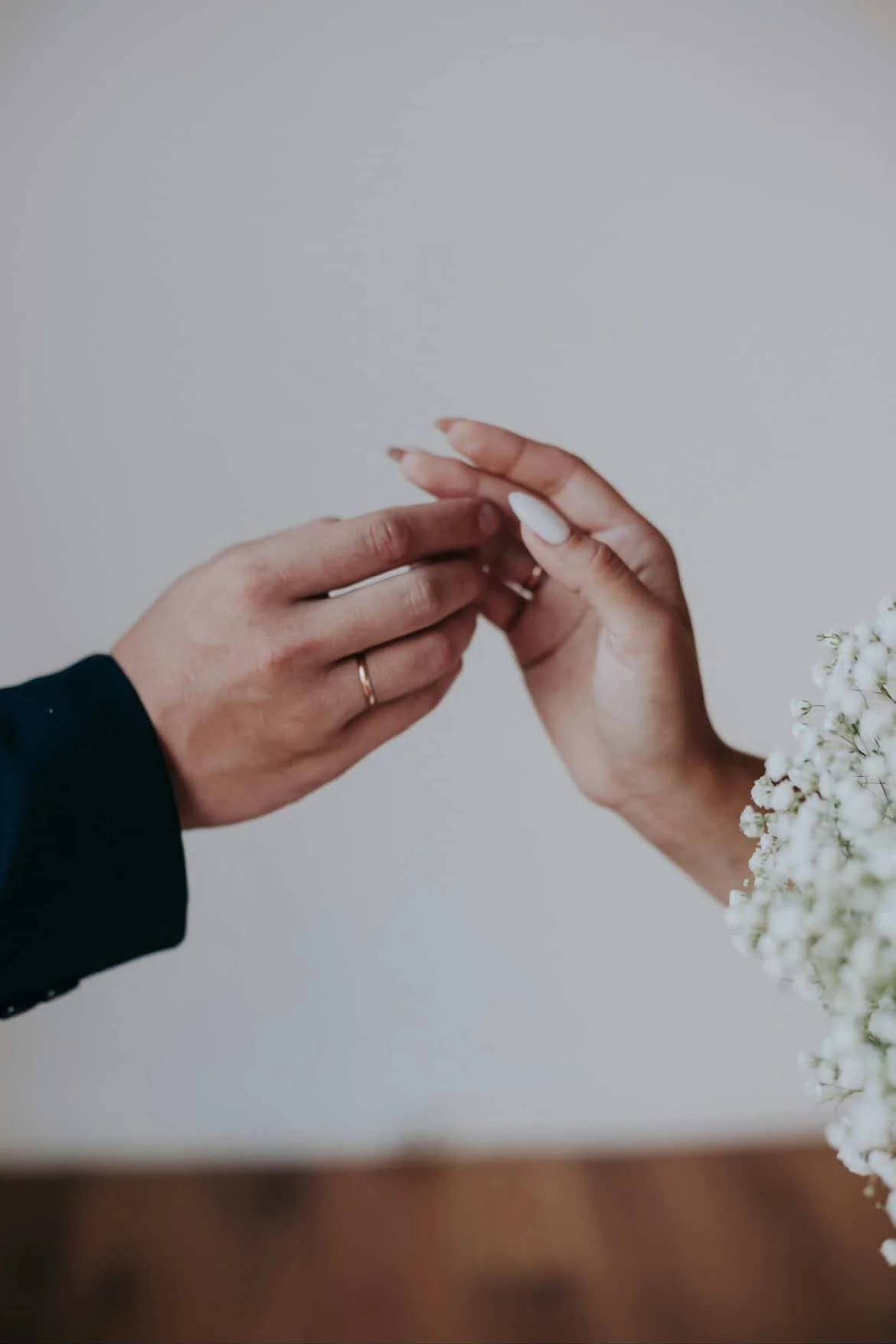 Pre matrimonial investigation concept showing couple exchanging rings before marriage verification process